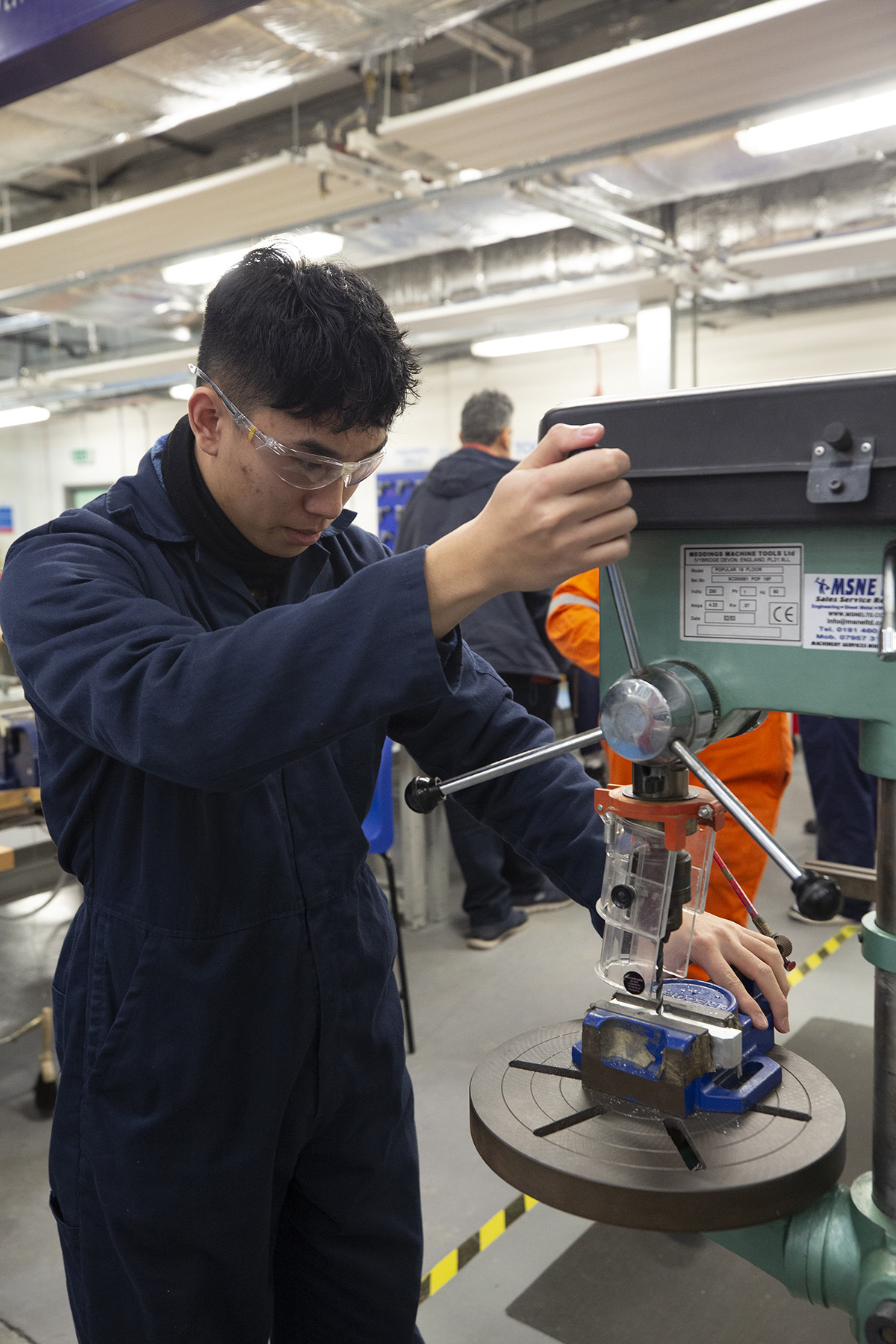 Student Working With Drill Portrait