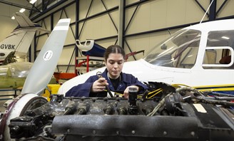 Student Working On Engine Wide Background